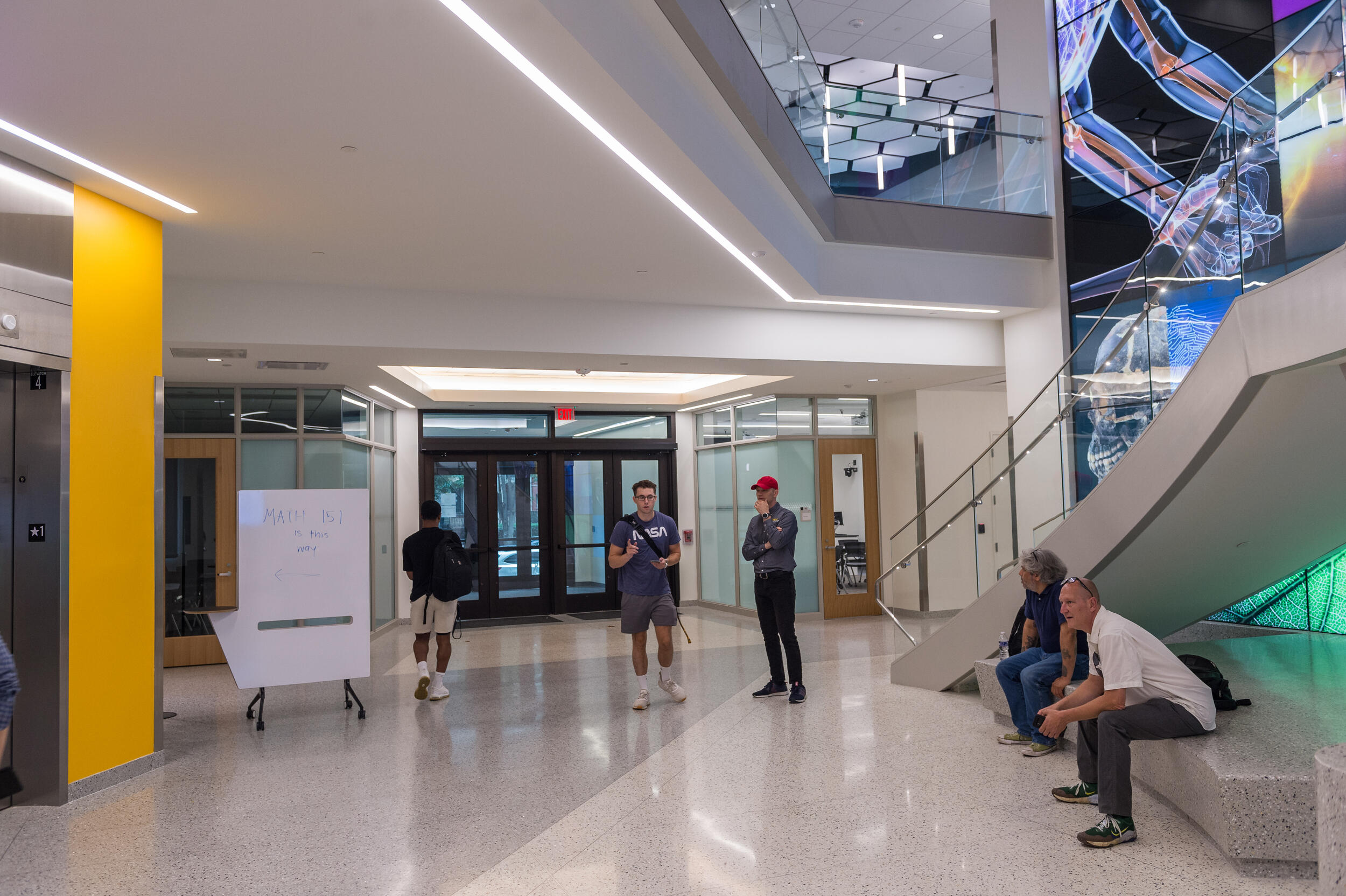 People standing in the lobby of a building 