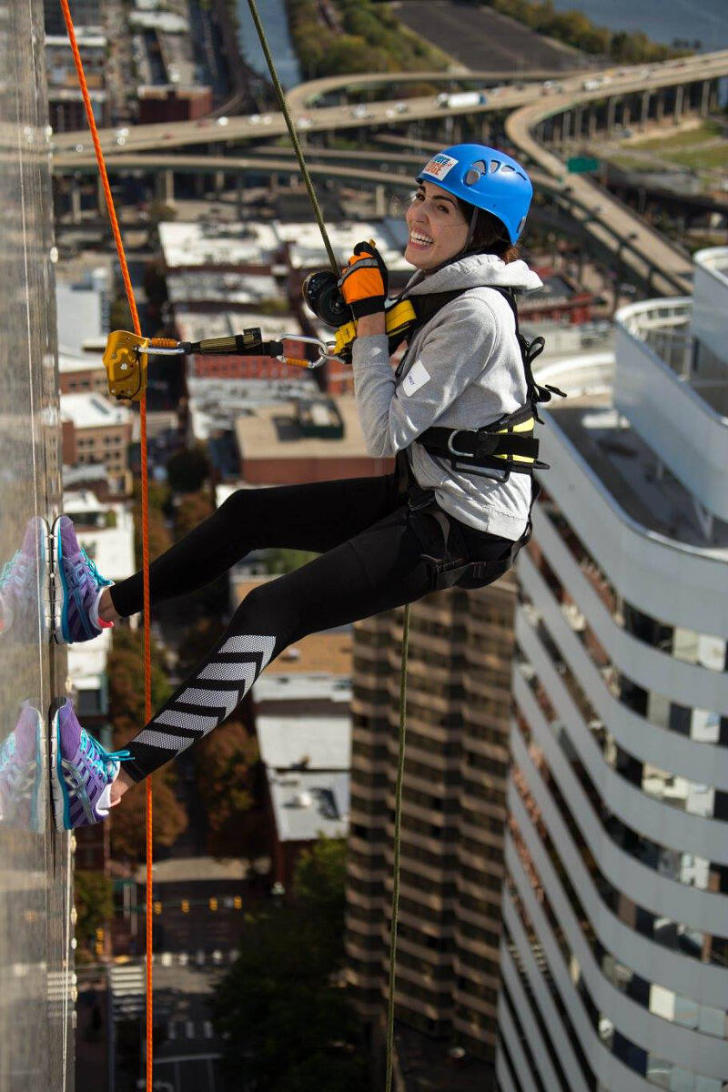 Hailey Spencer rappels from the SunTrust Center. 
Courtesy of Dave Parrish Photography