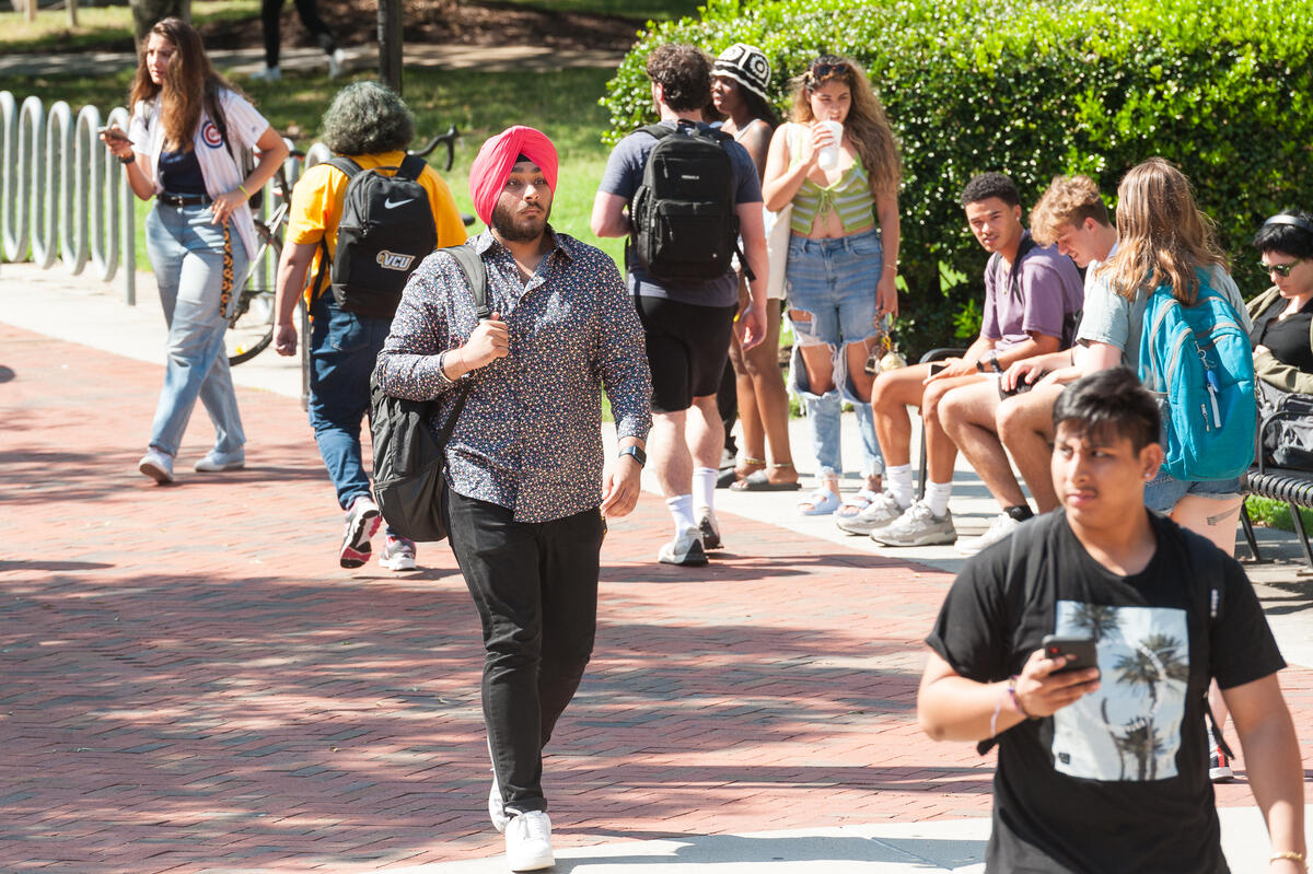 Students walking in the Commons plaza area 