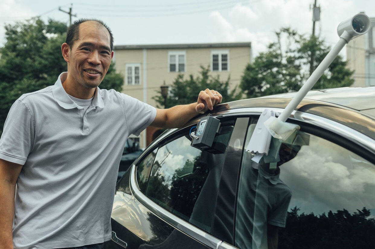 VCU College of Engineering chemical and life science engineering professor Stephen S. Fong affixes a monitor on his car to measure local ozone pollution.