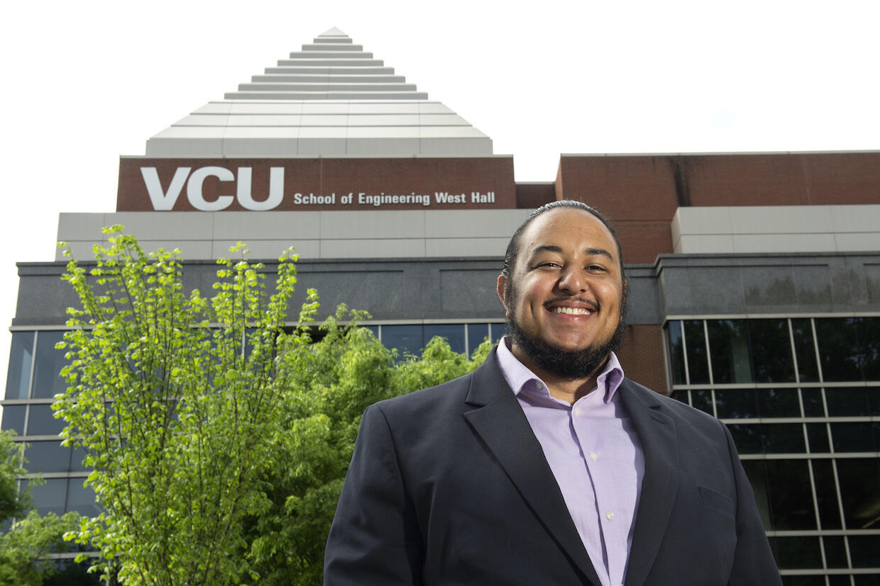VCU student Myles Boyd standing in front of Engineering West Hall.