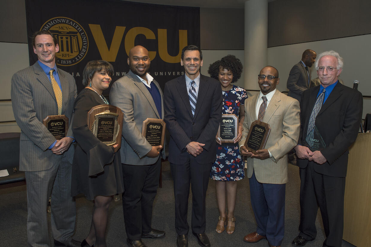 VCU President Michael Rao, Ph.D., center, flanked by the 2018 PACME award recipients. From left: Thomas Bannard, Anita Nadal, Corey Boone, Rao, Lauren Griggs, Carlton Goode, and Harold Greenwald, who accepted the award on behalf of the late Jan Chlebowski, Ph.D.