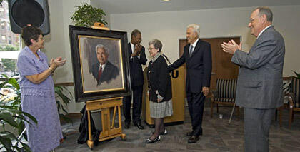 Esther C. Brandt (center) and Warren W. Brandt admire the newly unveiled portrait of Brandt, VCU’s first president, which will hang on the east wall of the Community Room, located on the first floor of Brandt Hall. Lois E. Trani (left), Henry G. Rhone, VCU vice provost for student affairs and enrollment services, and VCU President Eugene P. Trani lead the applause. 

Photo by Allen Jones, VCU Creative Services
