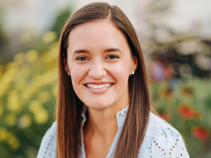 A photo of a woman from the shoulders up. 