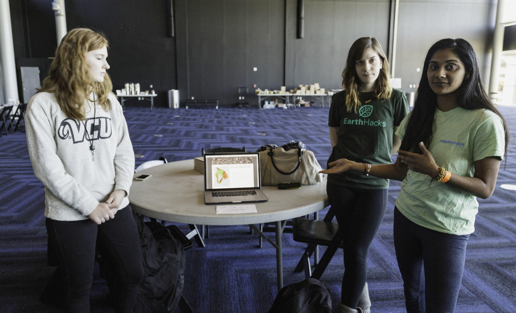 At VCU Engineering's first EarthHacks, senior graphic design student Emma Coté (left), teamed with Setty Duncan, a junior biology major, and chemical engineering senior Pooja Nanjannavar to develop an idea to investigate the cause of a fungal pathogen that is killing off ohia trees in Hawaii.
