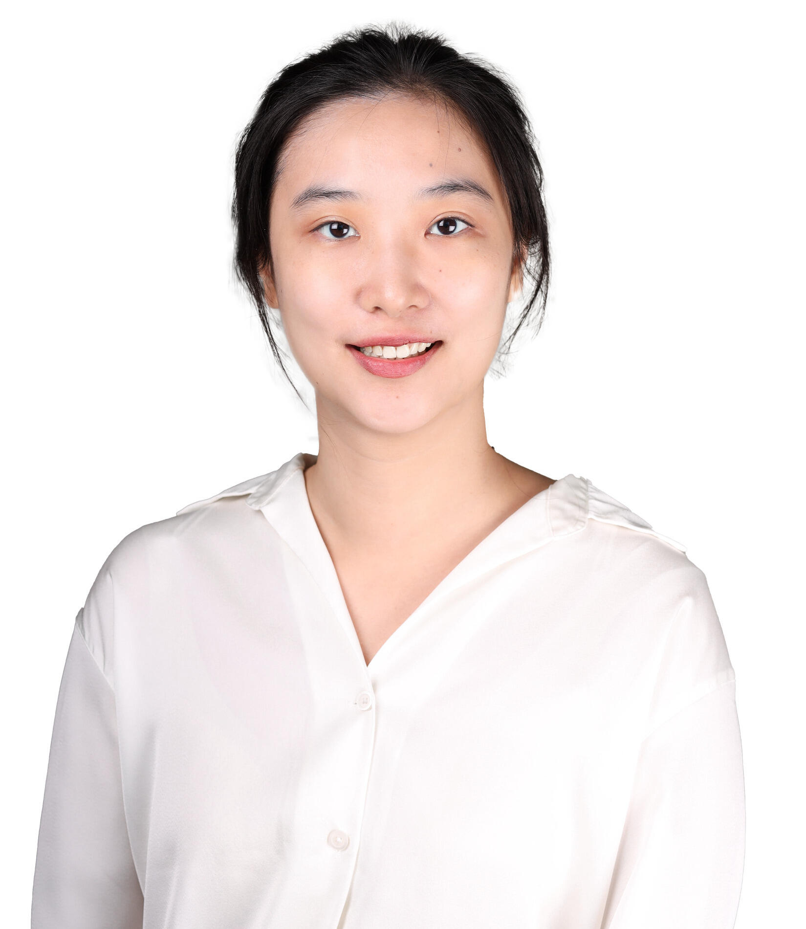 A smiling woman in a white top.