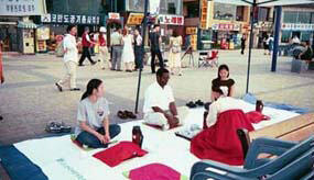 Students Lee and Kim are pictured with Dr. Anthony Guiseppi-Elie in Incheon, Korea.