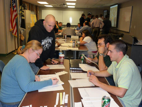 Students in VCU’s Homeland Security and Emergency Preparedness (HSEP) program consider their response to a community “disaster” in a daylong tabletop exercise on Nov. 30. The exercise tested their ability to coordinate a response in the areas of emergency management, intelligence fusion, firefighting, external affairs, public safety, and public health and medical resources. Mentors, including representatives from VCU and Henrico County, supported the students and provided feedback. Photos by Mike Porter, University Communications and Public Relations.