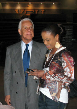 Richmond Mayor L. Douglas Wilder, the first elected African-American governor in American history, talks informally with a participant before delivering the afternoon’s keynote address.  Photo by Mike Porter/VCU Office of University News Services. 