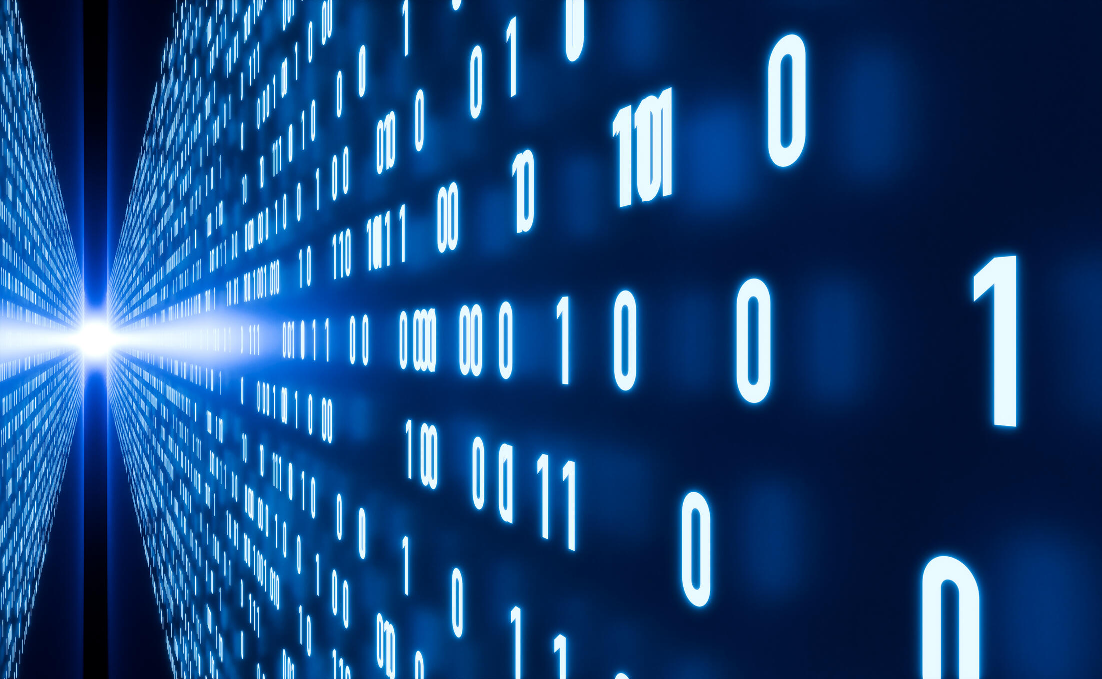 An image of binary code running against two walls that have a beam of light shining between them. 