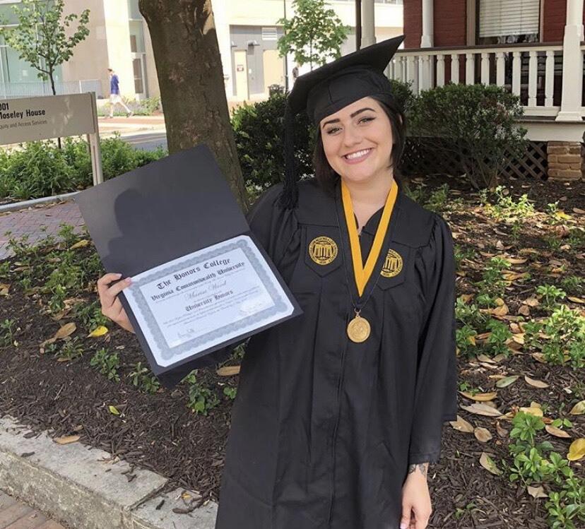 Marisa Wood holds her diploma from The Honors College of Virginia Commonwealth University.