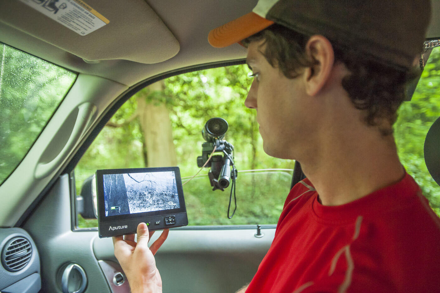 Ryan Levering, a senior environmental studies major, demonstrates the use of the a thermal imaging camera, which the team uses to find birds' nests in Bryan Park.