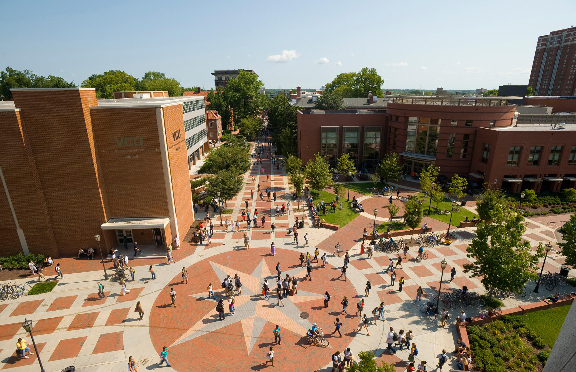 Aerial view of the Compass area on VCU's Monroe Park campus, an open common area filled with people.