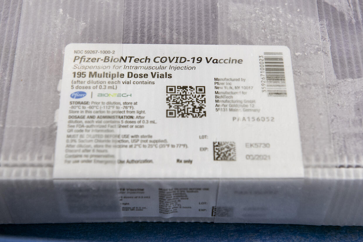 a shipping label on a box of COVID-19 vaccine