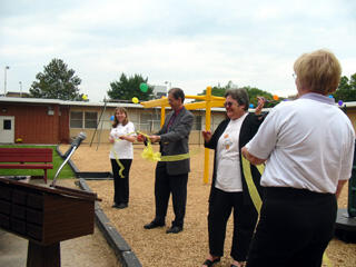 VTCC Playground Dedication Ribbon Cutting Ceremony. Brian Meyer, Ph.D., with Ashley Hines. Photo by Malorie Janis/VCU News Services.