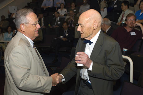 VCU President Eugene P. Trani congratulated Nobel laureate John Fenn at the symposium in his honor on Friday. “Many scientists all over the world have been influenced by the research of Dr. Fenn, including all the distinguished speakers we have with us today,” Trani said. “John is a consummate academician, scientist and gentleman. He is a national treasure who has made contributions of exceptional societal value to this country.  Experts in a number of fields have classified John’s work as befitting of the most elite of awards.” Trani announced that VCU is establishing the John Fenn Chair Professorship in Chemistry in recognition of his research contributions. (Photo credit: Allen Jones, VCU Creative Services)