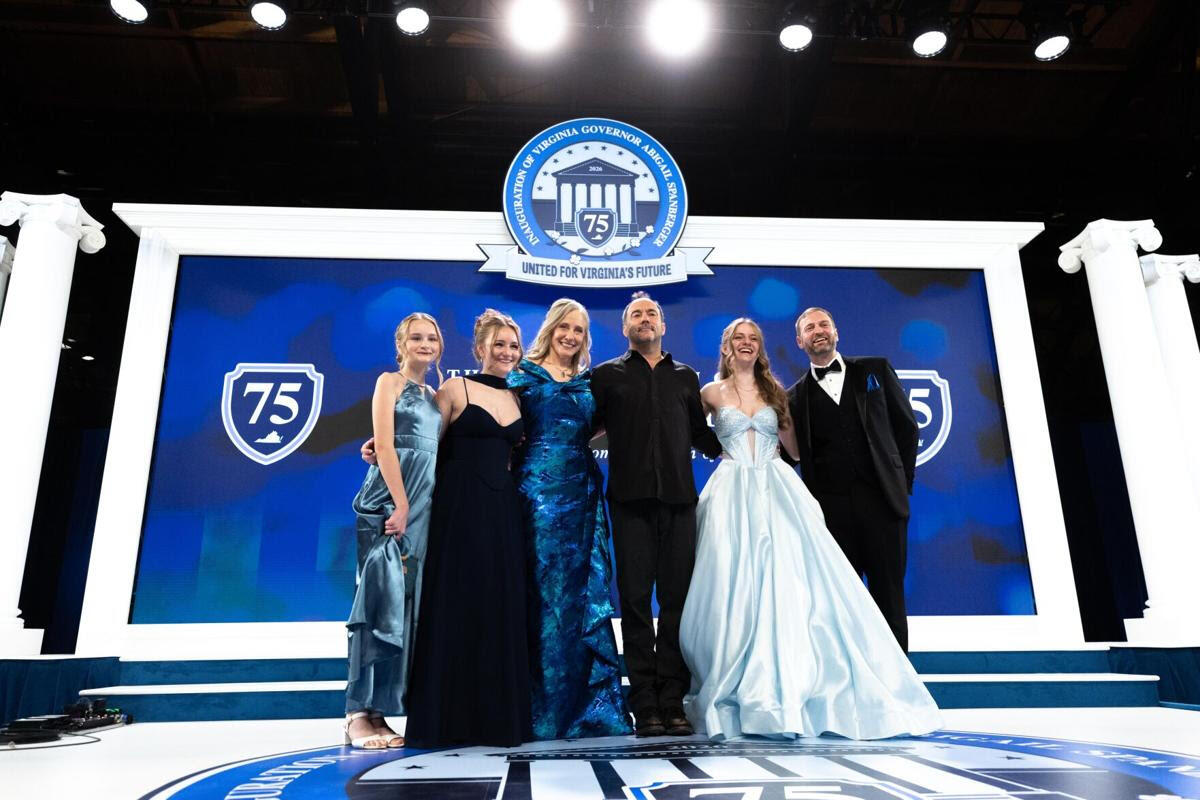 A photo of six people standing on a stage. 