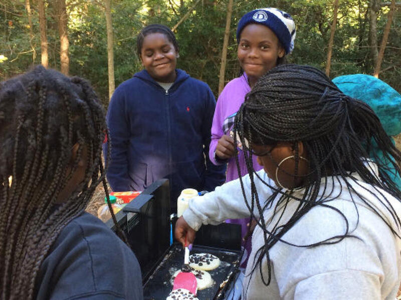 Blue Sky Fund Students prepare chocolate pancakes during a camping trip in October at the Rice Rivers Center. Blue Sky Fund and Rice Rivers Center have collaborated to help Richmond's youth explore the outdoors and learn environmental science. Contributed photos courtesy Blue Sky Fund