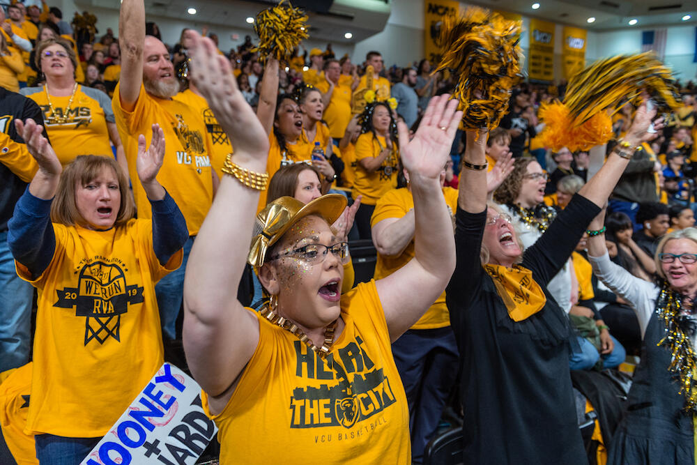 Kristen Lee and other fans cheer and stomp for the Rams. Photo by Kevin Morley, University Relations.