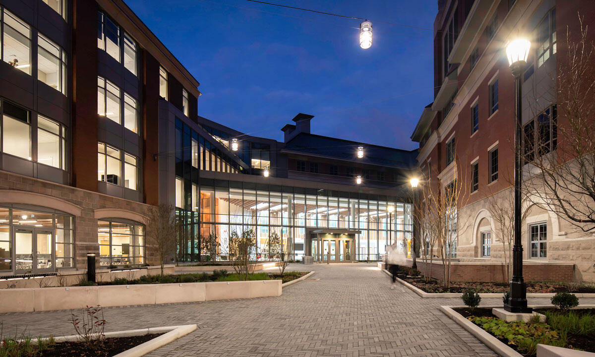 A photo of an outdoor courtyard entranced to a building