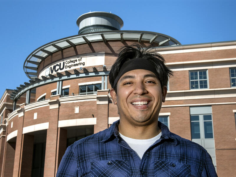 Jesus Guerrero standing in front of the VCU College of Engineering building 