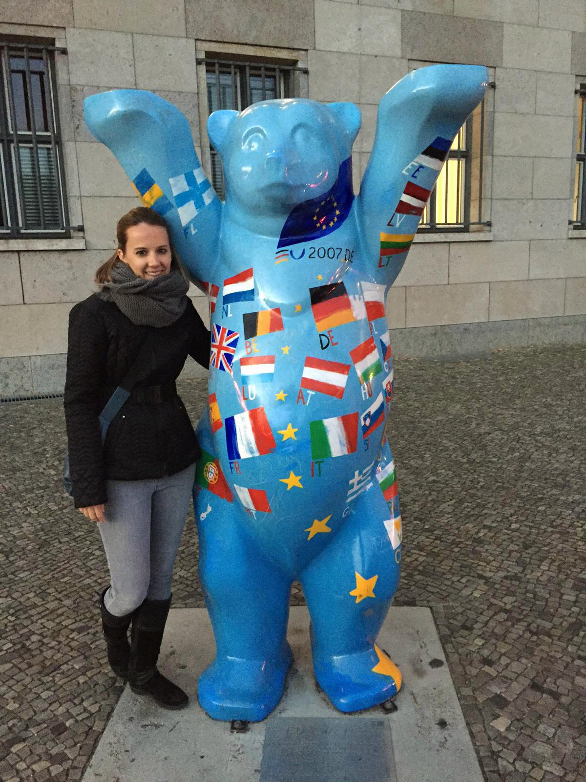 Sarah Carrier with a "Buddy Bear," painted with the flags of the European Union, in Berlin, Germany.
