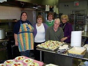 Stephanie Kite of the VCU School of Business (center with green sweater) and other volunteers worked at the annual Cub Scout Blue and Gold Banquet on Feb. 26, cooking and serving food to the 150 scouts and guests. Photo provided by Stephanie Kite.