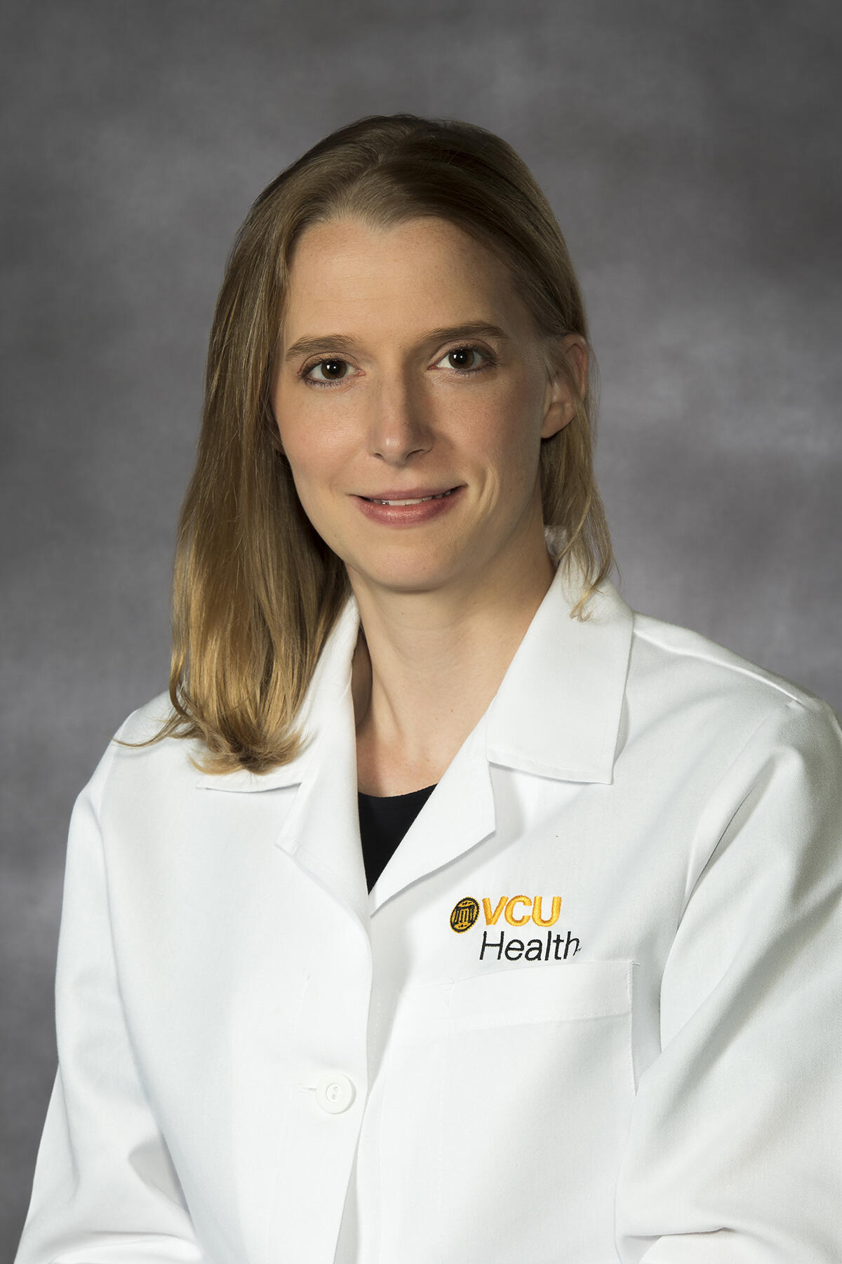 Woman in white doctor's coat.