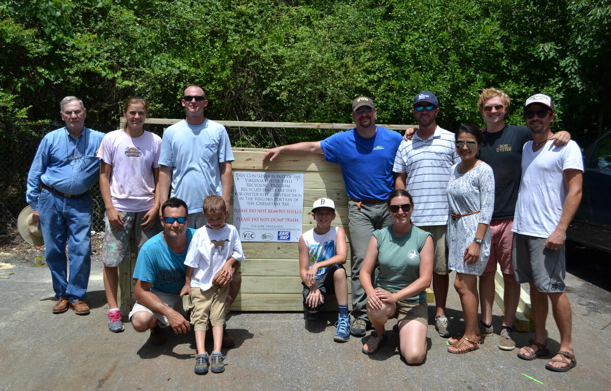 Volunteers help with construction of the oyster shell recycling bin in Kilmarnock on June 19. 