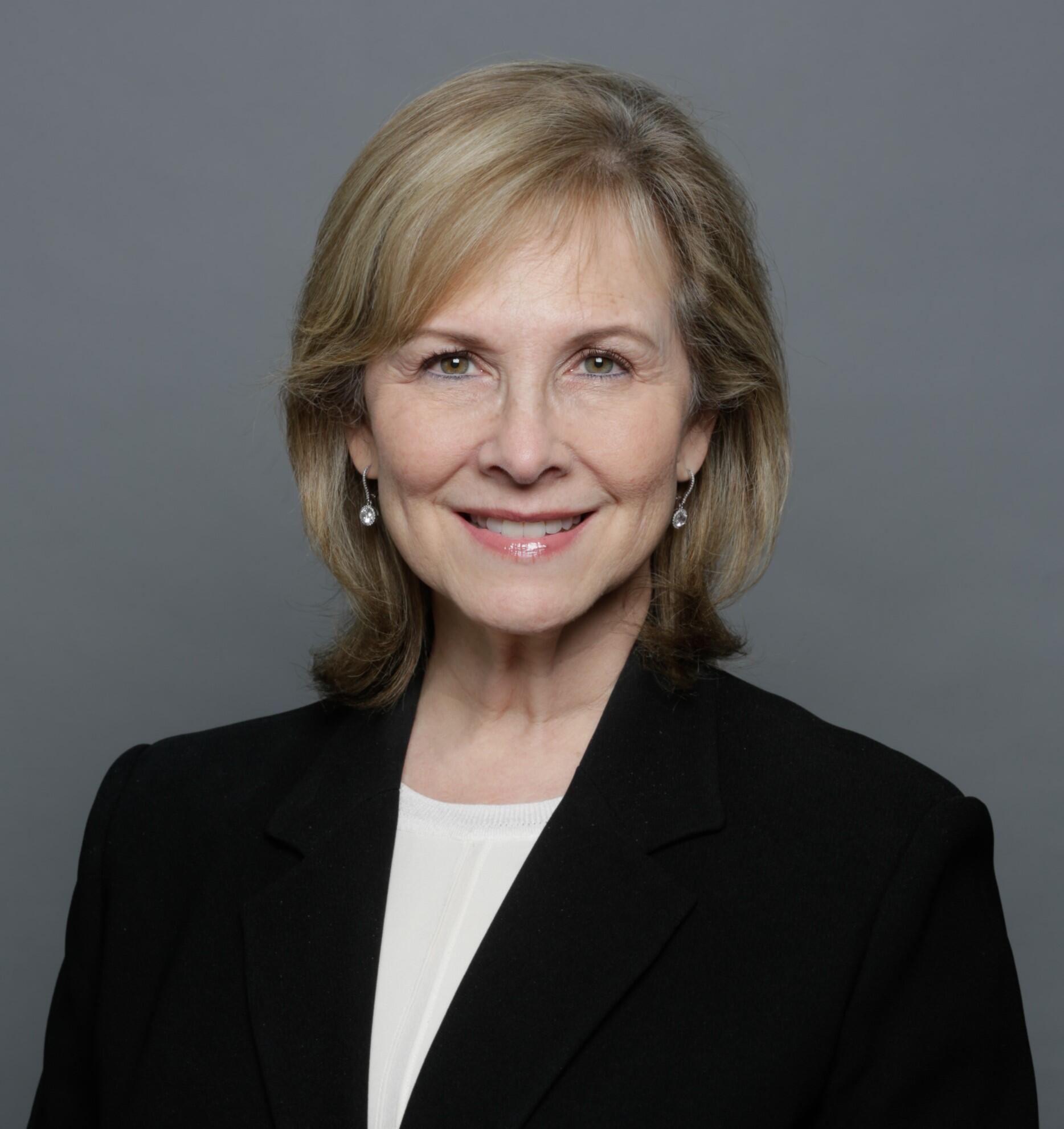 A head-and-shoulders image of a smiling woman.