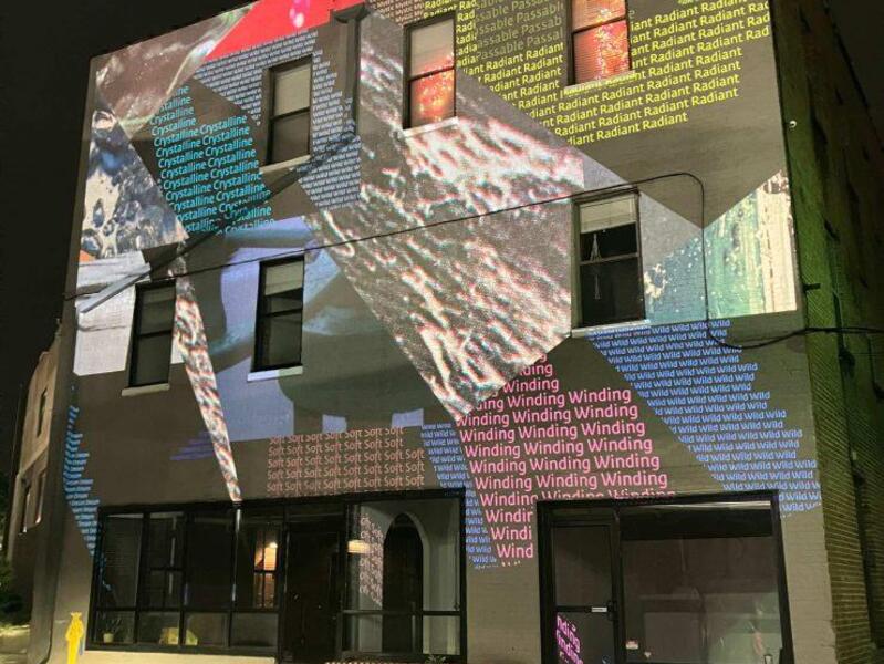 A photo of a projection on a building. 