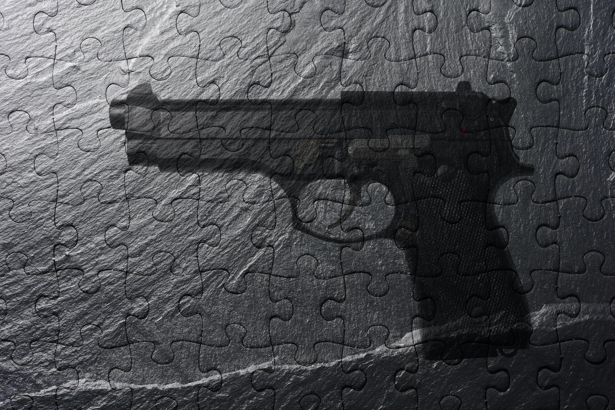 abstract image of a puzzle showing a handgun