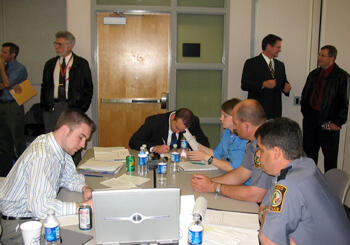 VCU homeland security and emergency preparedness students were paired with professional mentors, including police, fire and emergency services personnel from both the City of Richmond and Henrico County.  The exercise took place in the City of Richmond’s Emergency Operations Center, which provided a real world environment for the students. L-3 Communications Services Group, a communications and surveillance products and services company, offered modeling and simulation software to help students manage regional emergency response personnel and equipment as the exercise progressed.  Photo by Mike Porter, VCU Office of University News Services.  