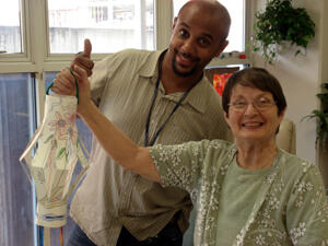 Adult day participants such as Marilyn Kim enjoy activities with art therapist Ross Browne. Photo by Dee Caras, program director,VCUHS Adult Day Services Program
