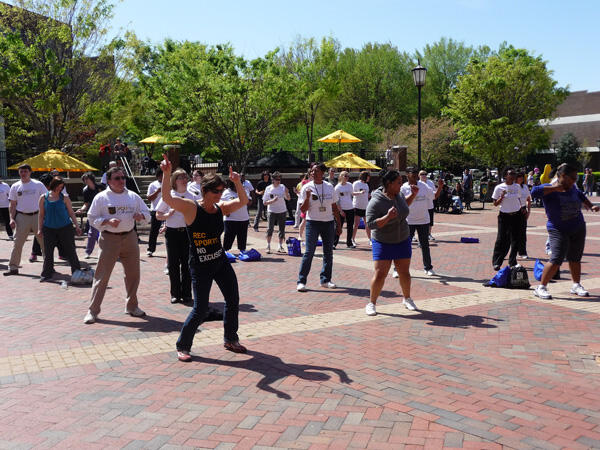 Participants in the 8th annual “Virginia’s Caring University Scholarship Campaign” Walk-A-Thon warm up at the University Student Commons Plaza before walking around Monroe Park. Final figures are unavailable for this year’s effort. However, to date, the Walk-A-Thon has raised more than $65,000 for more than 70 juniors and seniors. The scholarship campaign is sponsored by the VCU Staff Senate.