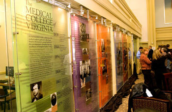 The design of the historical timeline panels correspond to stained glass windows, harkening to the Hunton Student Center's origin as a church. An etched image of the Egyptian building runs across the panels. 