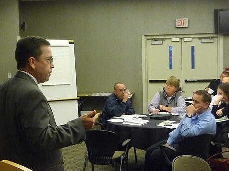 VCU Police Capt. Grant Warren (left) teaches participants that proper design and maintenance of a building or space can discourage criminal activity. Photo by Mike Porter, VCU Communications and Public Relations