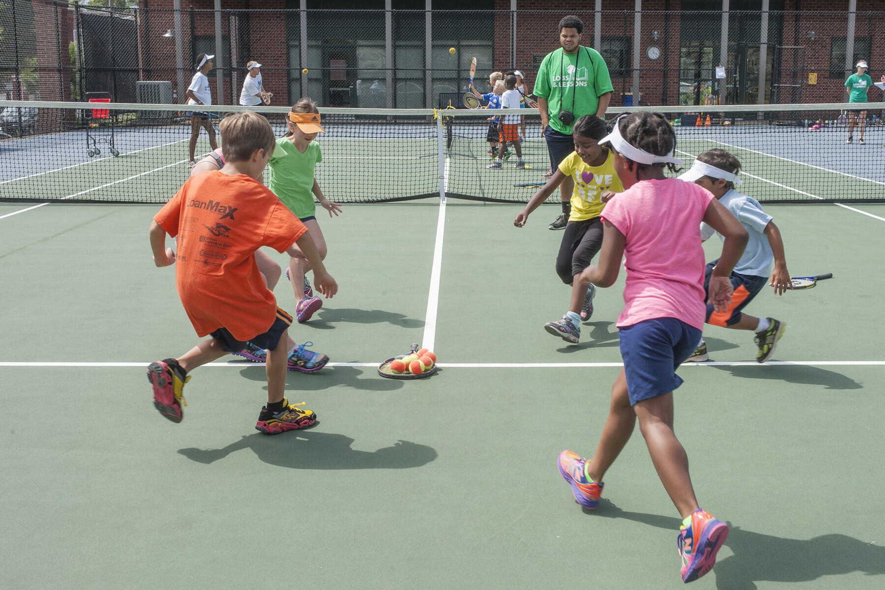 Children play at Lobs & Lessons, a youth enrichment program that promotes life skills through tennis. (File photo)