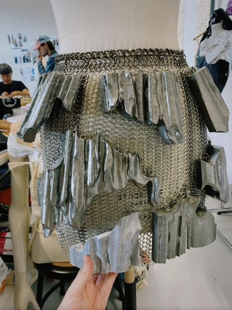 A skirt that looks like it's made out of chain mail and metal 