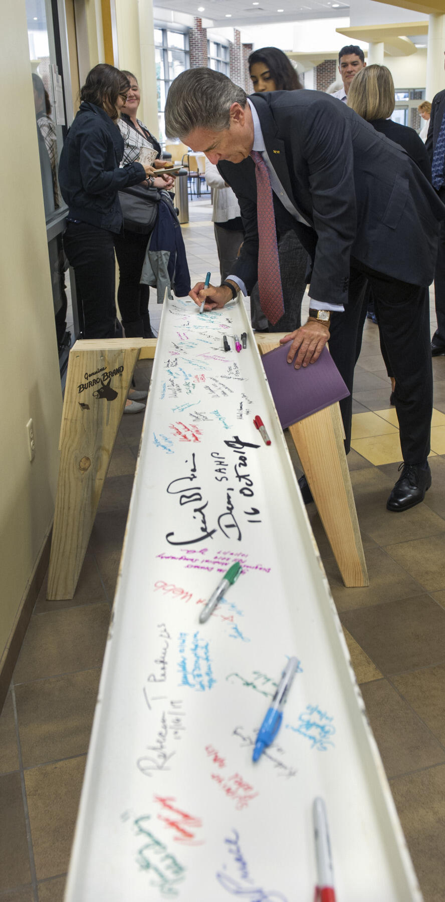 MCV Foundation board of trustees chair Harry Thalhimer signs the School of Allied Health Professions beam on Monday morning. "It is unbelievable how quickly this building has gone up," Thalhimer said. "It marks the beginning of the transformation of this outstanding campus."