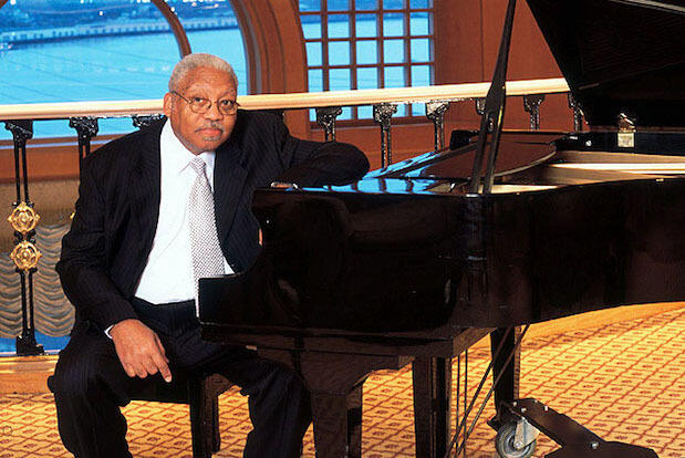 Ellis Marsalis seated at a grand piano.