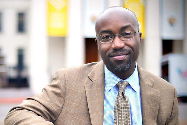 Man in brown jacket.