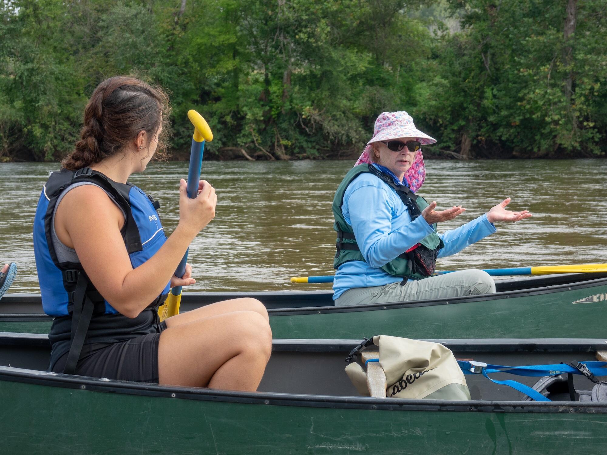 Lynn Crump, coordinator of the Virginia Scenic Rivers Program of the Department of Conservation and Recreation, mentors VCU students conducting a field assessment of a Virginia river. 