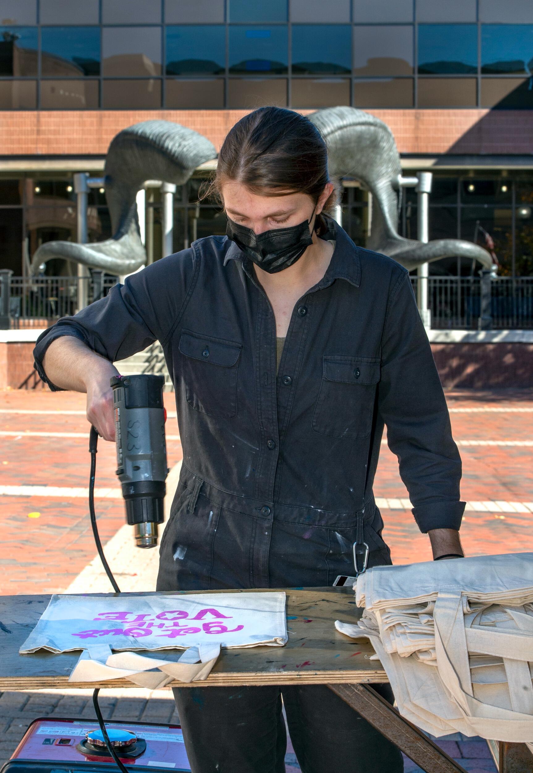 Students screen print tote bags at a VCU Votes event on Oct. 27.