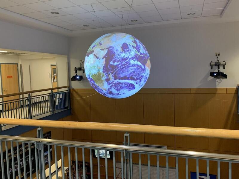 Science On a Sphere, a 6-foot diameter sphere suspended 25 feet above the ground, shows animated images of the atmosphere, oceans and land. (Courtesy photo)