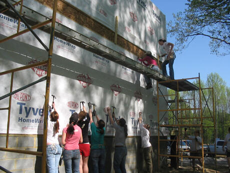 The planning students worked with other VCU students who are members of the American Society of Interior Design to build several Habitat for Humanity houses in South Richmond. Photo by Mike Porter, University Communications and Public Relations. 