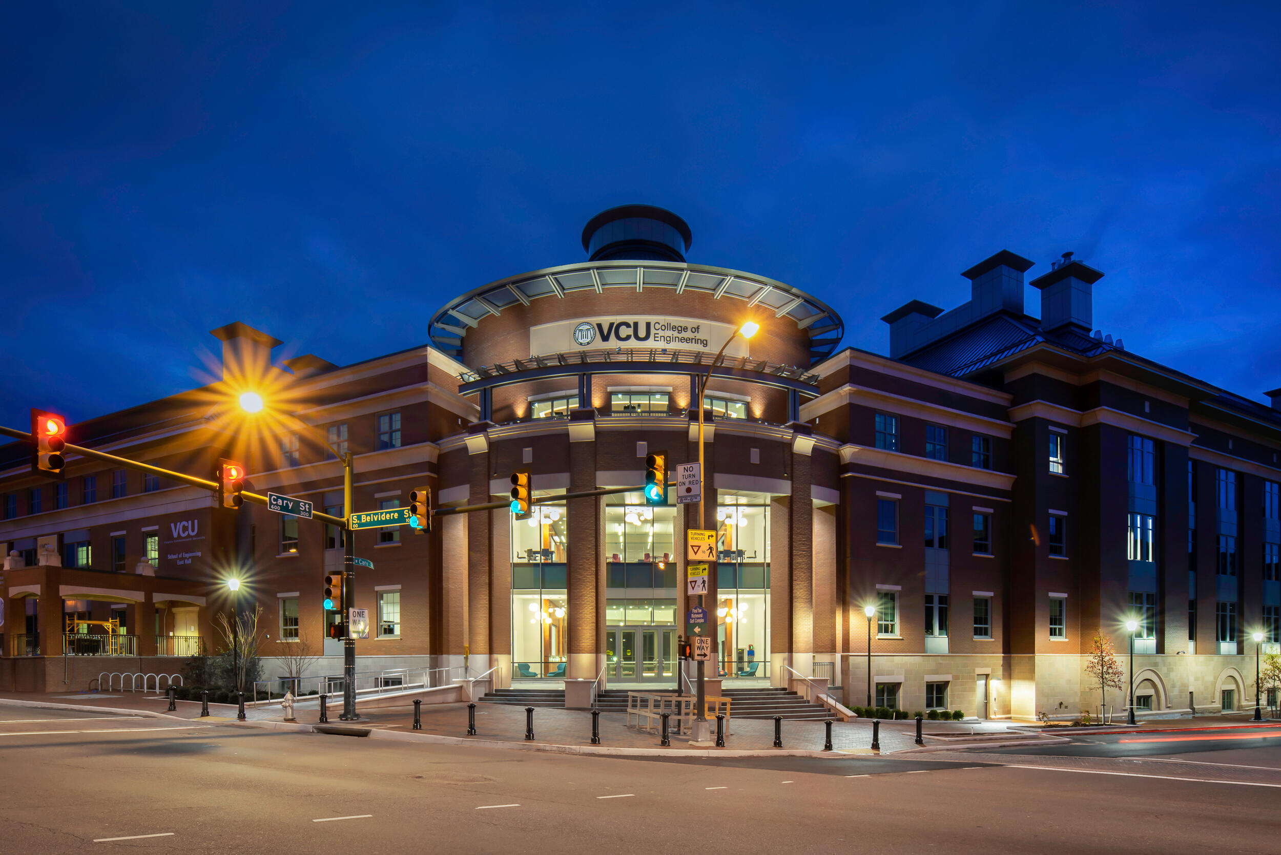 The VCU Engineering Research Building at the corner of two major roads at night
