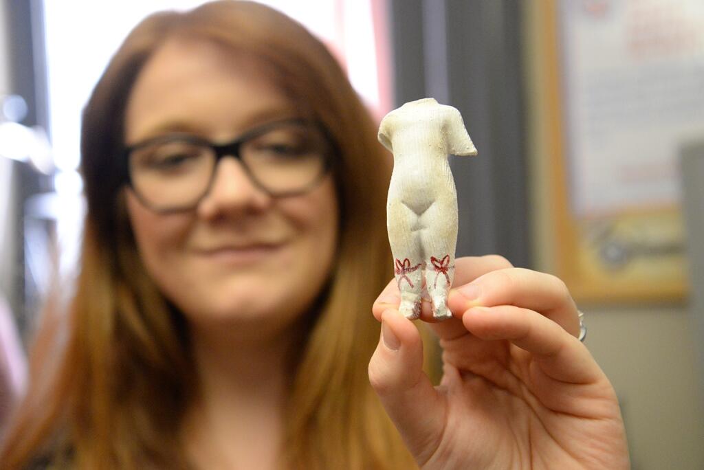 Kristen Egan, a research assistant in the Virtual Curation Laboratory, displays a 3-D-printed replica of a clay doll discovered at the Frederick Douglass National Historic Site in Washington, D.C.