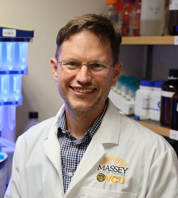 A photo of a man from the chest up. 