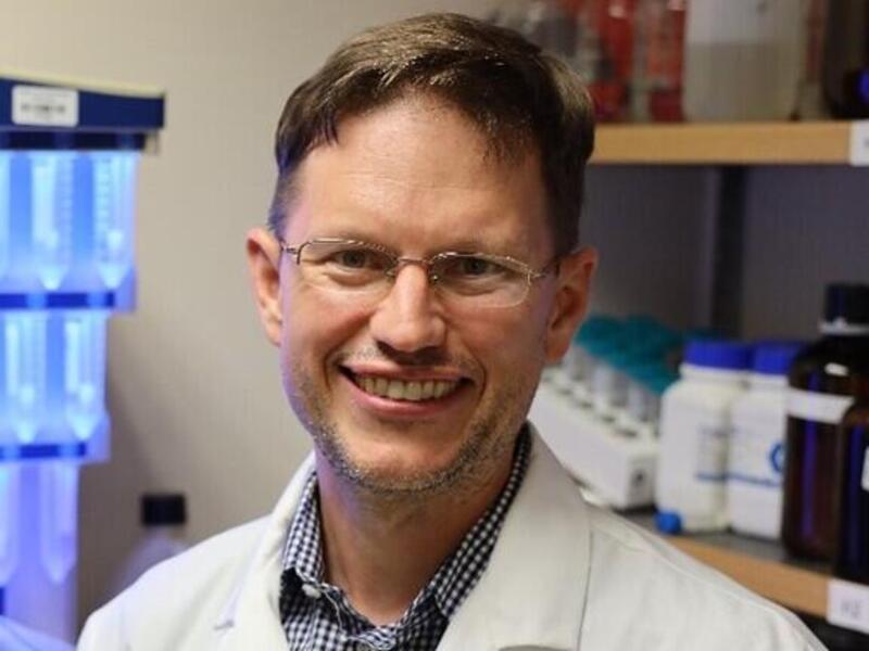 A photo of a man from the chest up. 